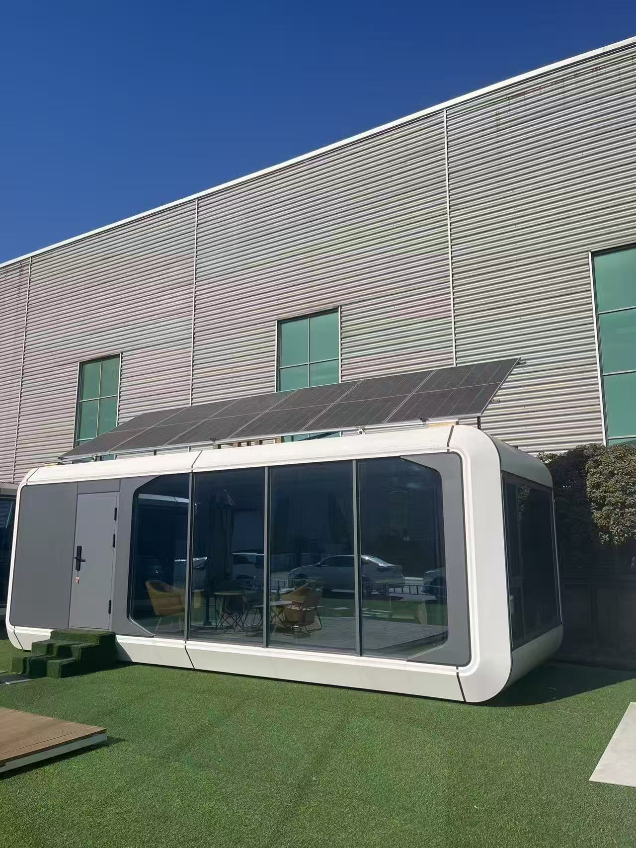 Compact modular house beside industrial building